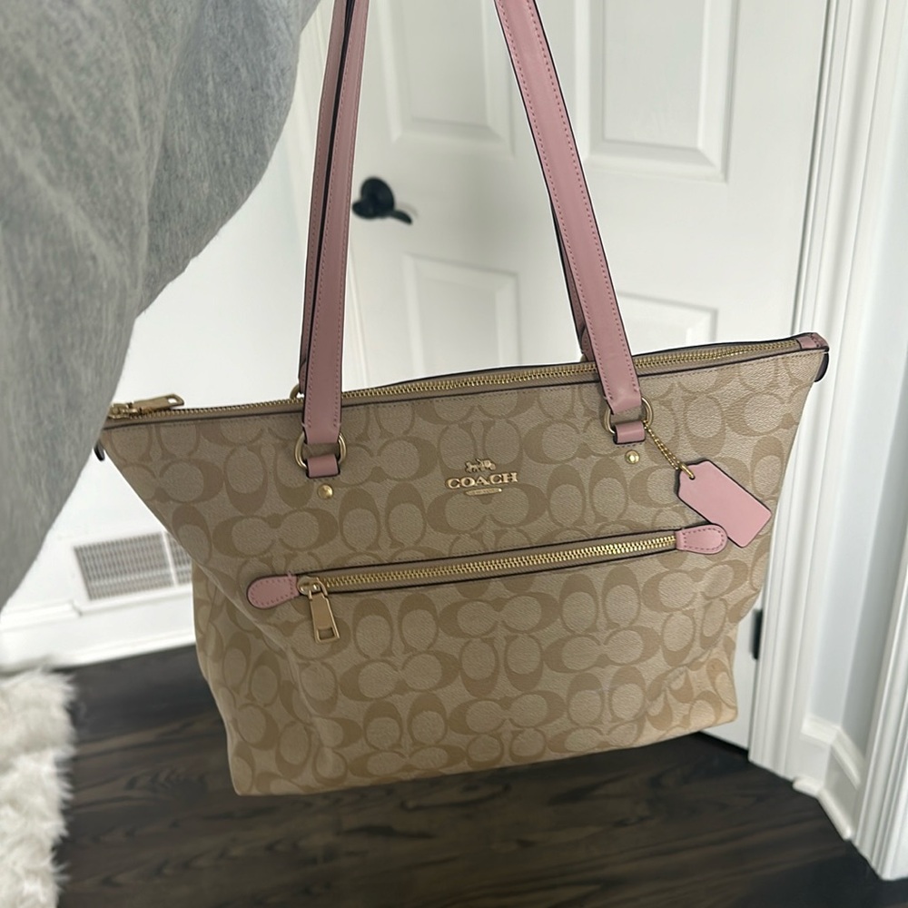 Coach purse in excellent condition, light tan with pink handles, tote size